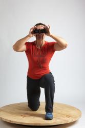 ANGELINA KNEELING POSE WITH SPYGLASS